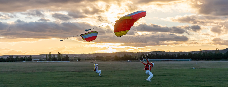 12 skydivers in a trace with smoke